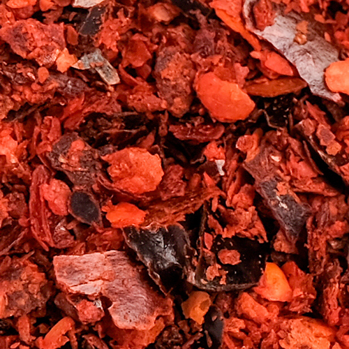 Close up of crushed red chili flakes representing Capsimax capsicum annuum extract ingredient used in supplements