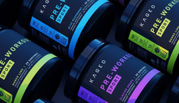 Colorful tubs of Kaged Pre-Workout Sport in multiple flavors arranged in a bold, high-impact flat lay.